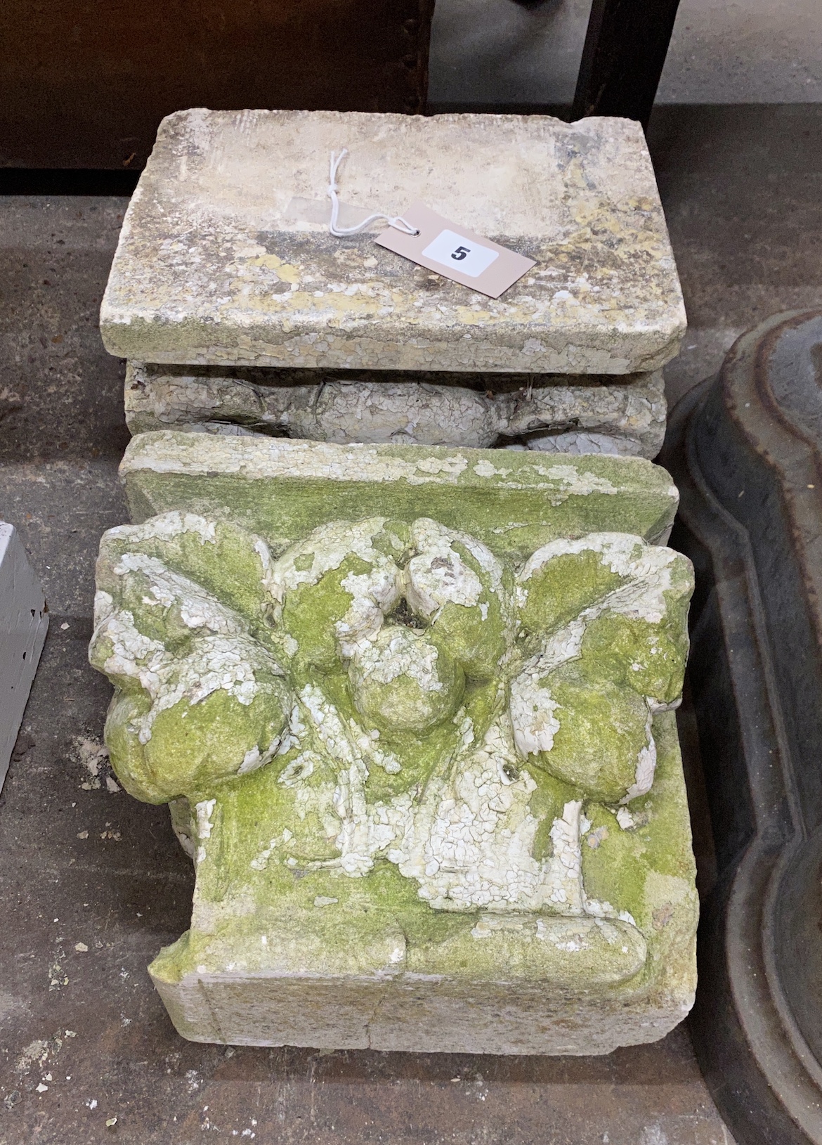 A pair of stone capitals, width 26cm, depth 18cm, height 24cm